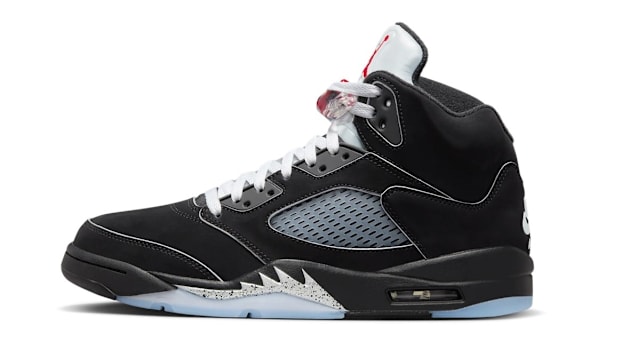 Side view of black and silver Air Jordan sneakers.