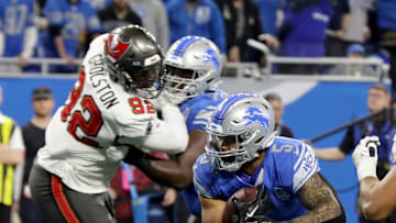 Detroit Lions running back David Montgomery slips through a hole during the second half against the Tampa Bay Buccaneers.