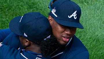 Apr 1, 2021; Philadelphia, Pennsylvania, USA; Atlanta Braves second baseman Ozzie Albies (1) and right fielder Ronald Acuna Jr. (R) hug before the start of an opening day game against the Philadelphia Phillies at Citizens Bank Park. Mandatory Credit: Bill Streicher-Imagn Images