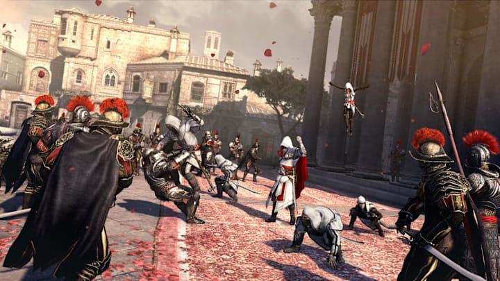 Ezio commanding a few assassins to attack a bunch of soldiers in front of the Vatican