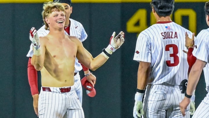 Arkansas Razorbacks' catcher Hudson White after teammates ripped off his shirt celebrating after delivering a game-winning hit in the 10th inning against the LSU Tigers on Friday night at Baum-Walker Stadium in Fayetteville, Arkansas.