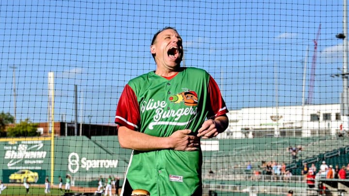 Nathan's Hot Dog Eating champion Joey Chestnut stretches his mouth before the Lugnuts game against the TinCaps on Thursday, Aug. 10, 2023, at Jackson Field in Lansing.