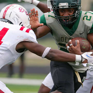 Duncanville's Nehemiah Borner attempts to tackle DeSoto's Deondrae Riden in Oct. 2023.