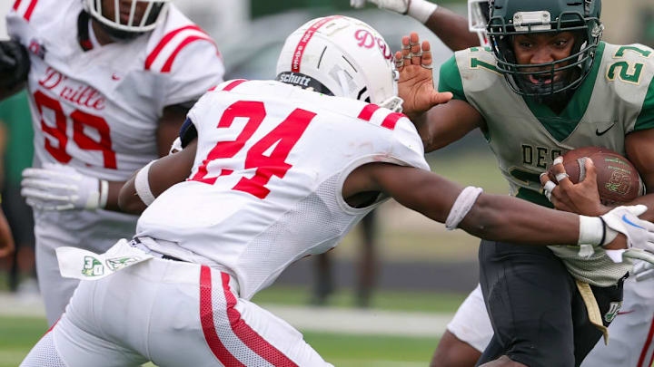 Duncanville's Nehemiah Borner attempts to tackle DeSoto's Deondrae Riden in Oct. 2023.