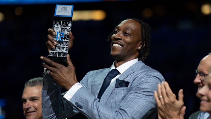 Dwight Howard celebrates being inducted into the Orlando Magic Hall of Fame during Monday night's game between the Magic and Los Angeles Lakers. Dwight Howard celebrates being inducted into the Orlando Magic Hall of Fame during Monday night's game between the Magic and Los Angeles Lakers.
