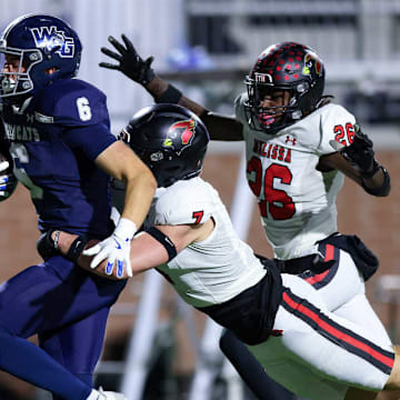Prosper Walnut Grove's Jack Jones is tackled by a Melissa defender in a game last week.