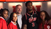 Recruit Lamar Wilkerson poses in the Simon Skjodt Assembly Hall locker room with Indiana coach Darian DeVries and his loved ones on April 12, 2025 during his official visit.