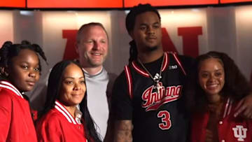 Recruit Lamar Wilkerson poses in the Simon Skjodt Assembly Hall locker room with Indiana coach Darian DeVries and his loved ones on April 12, 2025 during his official visit.