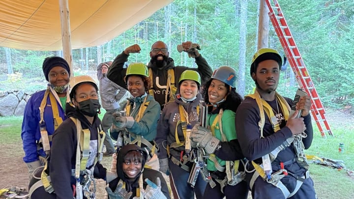 Clifton Harcum (back row) and a group of students harnessed up