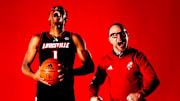 Kennesaw State transfer guard Adrian Wooley and Louisville head coach Pat Kelsey