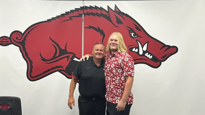 University of Arkansas head football coach Sam Pittman and Hot Springs Lakeside offensive lineman Tucker Young. 