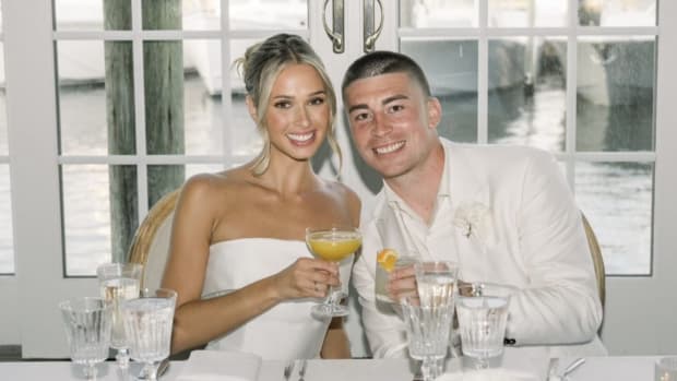 Former Oregon Duck Payton Pritchard and wife Emma MacDonald share a toast at their wedding in Massachusetts over the weekend.