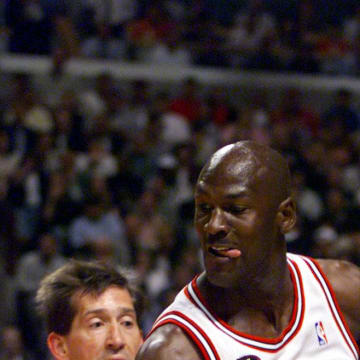 June 10, 1998; Chicago, IL, USA; Chicago Bulls guard Michael Jordan dribbles against Utah Jazz defender Jeff Hornacek in the first quarter of game four of the 2018 NBA Finals at the United Center.  Mandatory Credit: Robert Hanashiro-USA TODAY