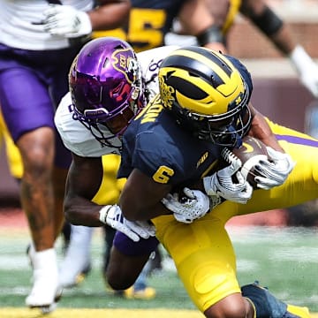 Michigan wide receiver Cornelius Johnson makes a catch against East Carolina defensive back Shavon Revel during the second half of U-M's 30-3 win on Saturday, Sept. 2, 2023, at Michigan Stadium.