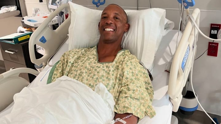 Sean Elliott pictured in a hospital gown at Methodist Healthcare in San Antonio following a successful cardioversion treatment for atrial fibrillation. 