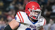 Grant Wise (63) gets set to engage with Saleem Mickles (44) during the Pace vs Milton spring football game at Milton High School on Thursday, May 18, 2023