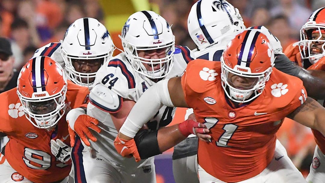 Sep 16, 2023; Clemson, South Carolina; Clemson defensive lineman Peter Woods (11) pressures Florida Atlantic quarterback Casey Thompson (11) during the second quarter against Florida Atlantic at Memorial Stadium. Sep 16, 2023; Clemson, South Carolina; Clemson defensive lineman Peter Woods (11) pressures Florida Atlantic quarterback Casey Thompson (11) during the second quarter against Florida Atlantic at Memorial Stadium.