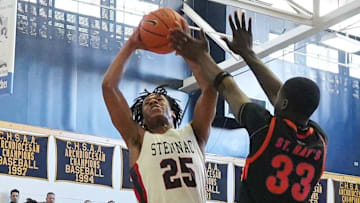 Stepinac's Jasiah Jervis (25) puts up a shot against St. Raymond during CHSAA AA Archdiocesan championship game at Mount Saint Michael Academy in the Bronx Feb. 22, 2025.