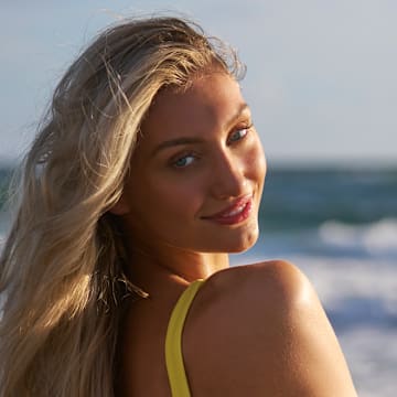 Cameron Brink was photographed by Ben Horton at The Boca Raton. Swimsuit by Andi Bagus. Swimsuit embroidered by Abbode.