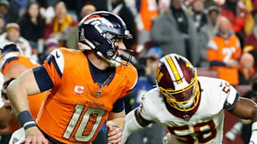 Denver Broncos quarterback Bo Nix scrambles with the ball against the Washington Commanders.