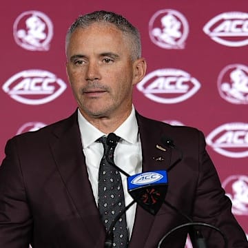 Jul 23, 2025; Charlotte, NC, USA; Florida State head coach Mike Norvell answers questions from the media during ACC Media days at Hilton Charlotte Uptown. Mandatory Credit: Jim Dedmon-Imagn Images