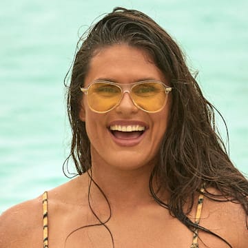 Ilona Maher was photographed by Ben Watts in Bermuda. Swimsuit by Tropic of C. Sunglasses by Bonnie Clyde.