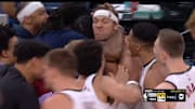 Jokic walked by the Nuggets celebrating Gordon's game-winner.