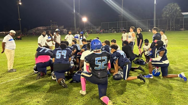 Trinity Catholic assistant coach and former Florida Gator Chris Rainey speaks to P.K. Yonge after the Celtics 37-0 win over the Blue Wave in Gainesville on October 25, 2024. Trinity Catholic assistant coach and former Florida Gator Chris Rainey speaks to P.K. Yonge after the Celtics 37-0 win over the Blue Wave in Gainesville on October 25, 2024.