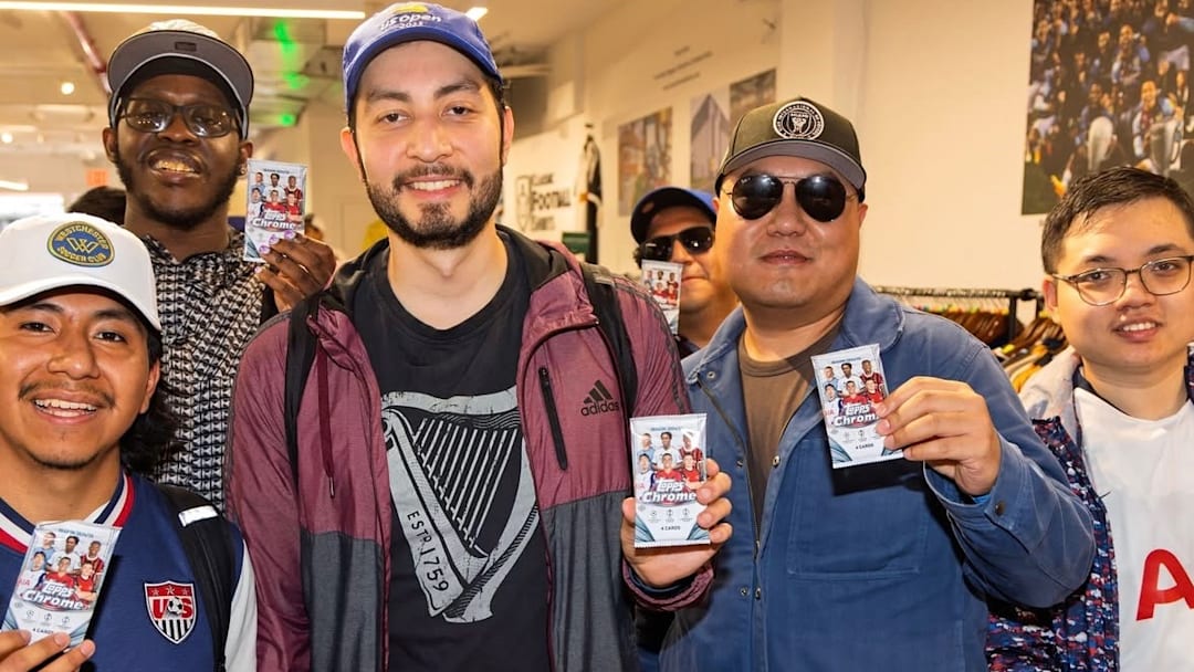 Collectors showing off packs of 2024-25 Topps Chrome UCC