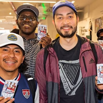 Collectors showing off packs of 2024-25 Topps Chrome UCC