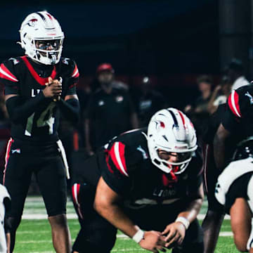 Chaminade-Madonna quarterback Malik Leonard (14) will lead the Lions into their 10th consecutive state championship game on Wednesday, Dec. 11, when they play Cardinal Newman for the Class 1A title at FIU in Miami. Chaminade-Madonna has won the last four state championships.