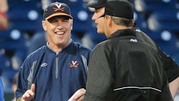 Jun 15, 2015; Omaha, NE, USA; Virginia Cavaliers head coach Brian O'Connor chats with the umpires prior to the game against the Florida Gators in the 2015 College World Series at TD Ameritrade Park. Mandatory Credit: Steven Branscombe-Imagn Images