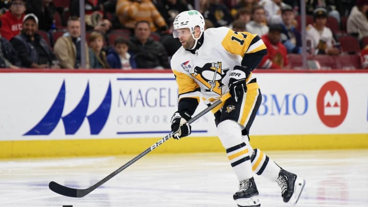 Pittsburgh Penguins forward Bryan Rust (17) skates against the Chicago Blackhawks at United Center.