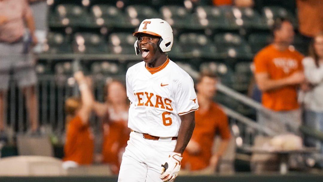 Texas Longhorns' outfielder Anthony Pack Jr. celebrates a grand slam against the USC Upstate Spartans.
