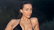 Penny Lane was photographed by Ben Watts in Portugal. Swimsuit by Agent Provocateur. Rings by Cleopatra’s Bling and VANESSA MOONEY. 