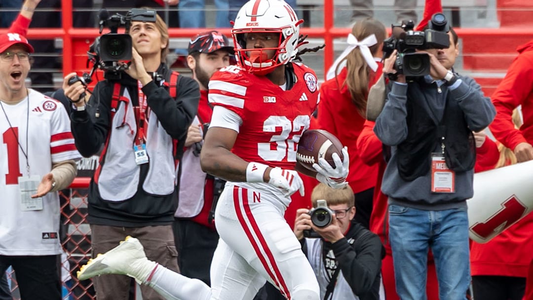 Kenneth Williams peeks back during his 95-yard kickoff return .