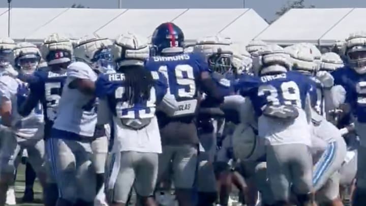 The New York Giants and Detroit Lions fight during a joint practice.