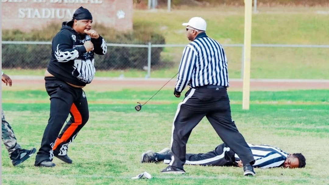 Viral photo of an adult male squaring up with a 7on7 football official at a tournament in North Carolina. Viral photo of an adult male squaring up with a 7on7 football official at a tournament in North Carolina.