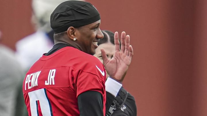 Jul 25, 2024; Buford, GA, USA; Atlanta Falcons quarterback Michael Penix Jr. (9) reacts on the field on the first day of training camp at Falcons Training Camp. Mandatory Credit: Dale Zanine-USA TODAY Sports