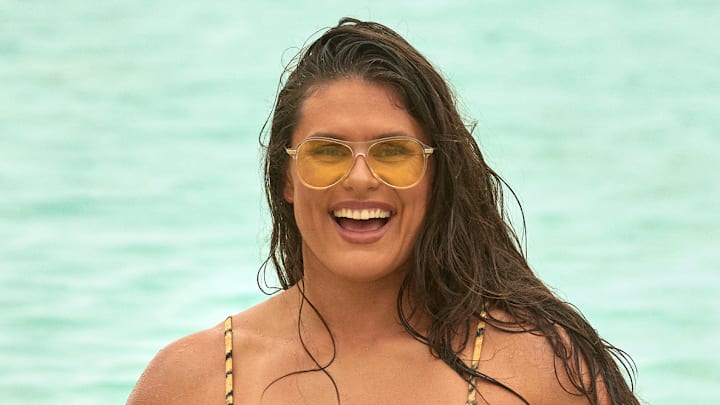 Ilona Maher was photographed by Ben Watts in Bermuda. Swimsuit by Tropic of C. Sunglasses by Bonnie Clyde.