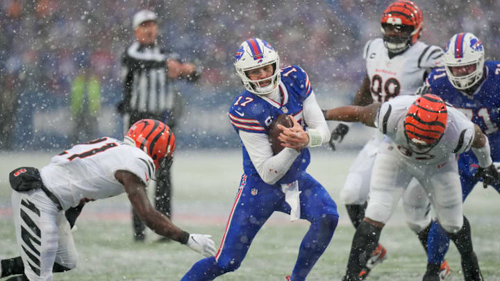 Buffalo Bills quarterback Josh Allen carries the ball against the Cincinnati Bengals 