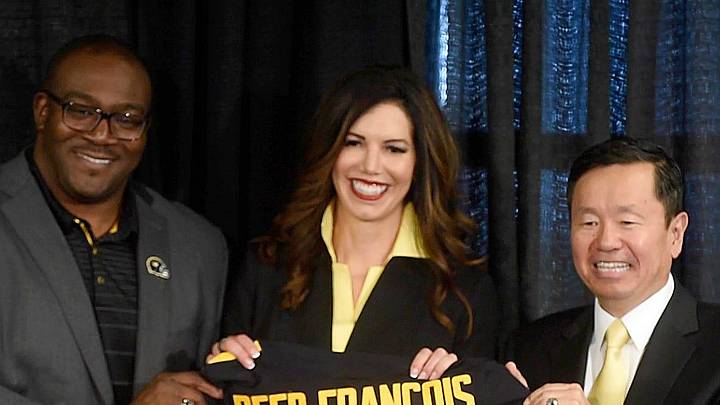 University of Missouri Curator Daryl Chatman, left, and System President Mun Choi present new athletic director Desiree Reed-Francois with a jersey Wednesday after she was formally introduced at the Walsworth Family Columns Club.

20210811 033a Mu Athletic Director Reed Francois Press Conf