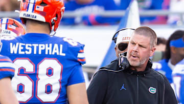 Florida Gators head coach Billy Napier talks to his team during a timeout during the first half at Raymond James Stadium in Tampa, FL on Friday, December 20, 2024 in the 2024 Union Home Mortgage Gasparilla Bowl. [Doug Engle/Gainesville Sun]