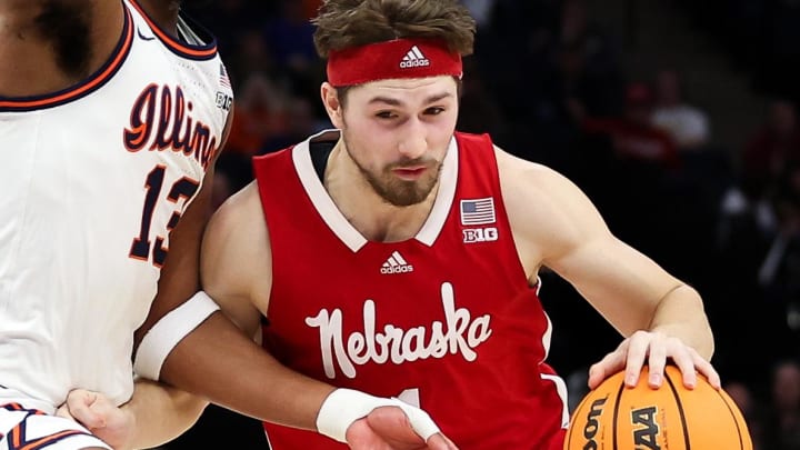 Mar 16, 2024; Minneapolis, MN, USA; Nebraska Cornhuskers guard Sam Hoiberg (1) works around Illinois Fighting Illini forward Quincy Guerrier (13) during the second half at Target Center.