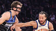 New York Knicks guard Jalen Brunson looks to drive past Orlando Magic forward Franz Wagner.