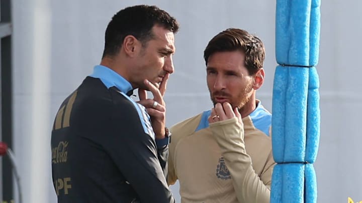 Lionel Scaloni (left) and Lionel Messi (right) chat during Argentina training ahead of their game against Chile.