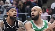 Boston Celtics guard Derrick White drives to the basket against Toronto Raptors forward Brandon Ingram