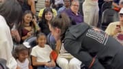 Indiana Fever's Caitlin Clark speaks with Vanessa, Natalia, Bianka and Capri Bryant at the 2024 WNBA All-Star Game.