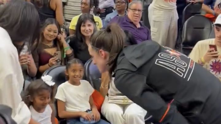 Indiana Fever's Caitlin Clark speaks with Vanessa, Natalia, Bianka and Capri Bryant at the 2024 WNBA All-Star Game.