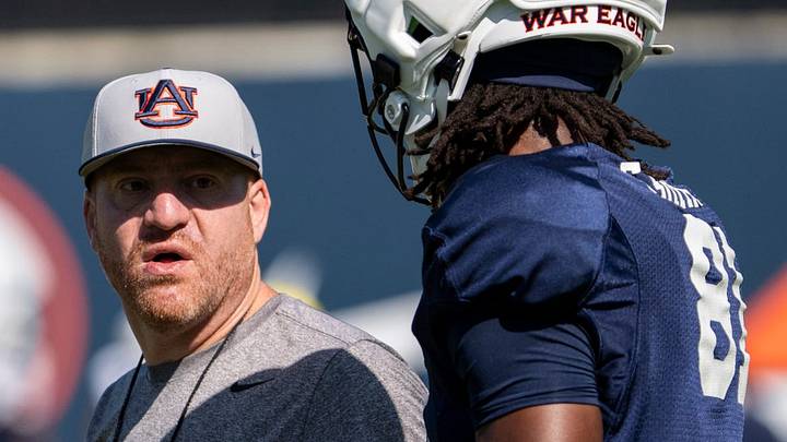 Auburn Tigers head coach Alex Golesh talks with wide receiver Erick Smith (81) during Auburn football practice at Woltosz Football Performance Center in Auburn, Ala. on Saturday, Aug. 8, 2026.